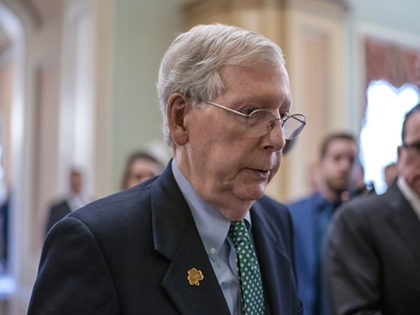 Senate Majority Leader Mitch McConnell, R-Ky., walks past reporters on the way to the chamber after announcing he has canceled the Senate recess next week, at the Capitol in Washington, Thursday, March 12, 2020. (AP Photo/J. Scott Applewhite)