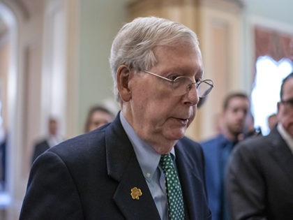 Senate Majority Leader Mitch McConnell, R-Ky., walks past reporters on the way to the cham