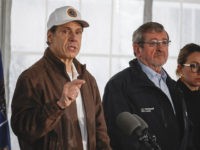 FILE - In this Friday, March 13, 2020, file photo, New York Governor Andrew Cuomo speaks during a news conference at a COVID-19 coronavirus infection testing facility at Glen Island Park in New Rochelle, N.Y. Unlike other countries dealing with the coronavirus outbreak, the U.S. has left much of the …