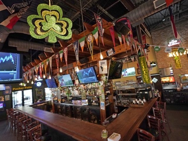 The bar is empty at Mo's Irish Pub on St. Patrick's Day, Tuesday, March 17, 2020, in Houst