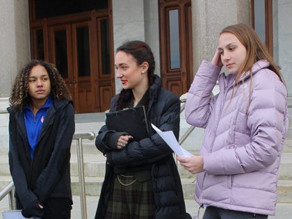 FILE - In this Feb. 12, 2020 file photo, high school track athletes Alanna Smith, left, Selina Soule, center and and Chelsea Mitchell prepare to speak at a news conference outside the Connecticut State Capitol in Hartford, Conn. The three girls have filed a federal lawsuit to block a state …