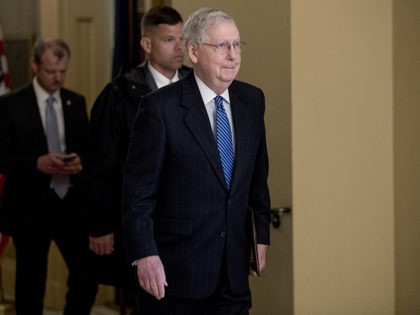 Senate Majority Leader Mitch McConnell of Ky. walks to the Senate Chamber on Capitol Hill in Washington, Monday, March 23, 2020, as the Senate is working to pass a coronavirus relief bill. (AP Photo/Andrew Harnik)
