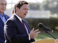 Florida Gov. Ron DeSantis delivers remarks during a press conference at a coronavirus mobile testing site Monday, March 23, 2020, in The Villages, Fla. The Villages, a retirement community, is one of the largest concentration of seniors in the U.S. (AP Photo/John Raoux)