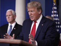 President Donald Trump speaks about the coronavirus in the James Brady Briefing Room, Tuesday, March 24, 2020, in Washington, as Vice President Mike Pence listens. (AP Photo/Alex Brandon)
