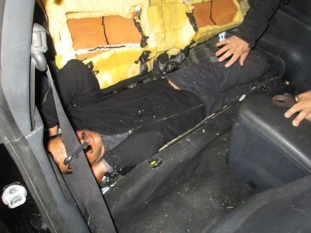 CBP officers find a man stashed inside the rear seat of a Mitsubishi sedan. (Photo: U.S. C