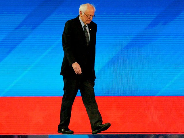 Democratic presidential hopeful Vermont Senator Bernie Sanders walks onstage as he arrives