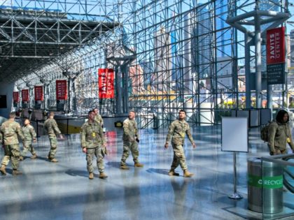 NEW YORK, NY - MARCH 27: Members of the National Guard gather at the Jacob K. Javits Convention Center, which is being turned into a hospital to help fight coronavirus cases on March 27, 2020 in New York City. Cuomo will be requesting authorization for four additional hospital sites amid …