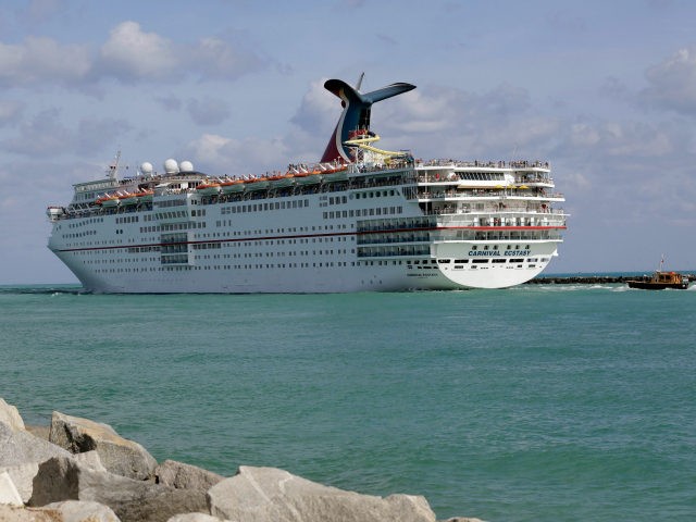 In this Monday, May 19, 2014 photo, the Carnival Cruise Lines ship Ecstasy leaves the Port