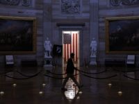 WASHINGTON, DC - MARCH 24: A man walks through the U.S. Capitol Rotunda, empty of tourists as only essential staff and journalists are allowed to work during the coronavirus pandemic March 24, 2020 in Washington, DC. After days of tense negotiations -- and Democrats twice blocking the nearly $2 trillion …