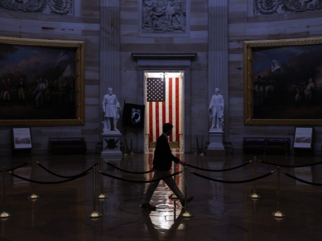 WASHINGTON, DC - MARCH 24: A man walks through the U.S. Capitol Rotunda, empty of tourists