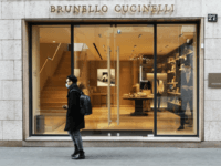 MILAN, ITALY - FEBRUARY 29: A man wears a protective mask as he walks in front of the Bruno Cucinelli store in Via Montenapoleone, the most important road of the fashion district in the city center where all the luxury brand are located on February 29, 2020 in Milan, Italy. …
