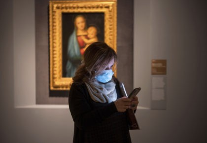 A woman wearing a mask attends a press preview of Raphael's exhibition in Rome, Wednesday, March 4, 2020. The paintings, drawings and sketches in the most ambitious assemblage ever of Raphael works in an exhibition, more than even the Renaissance superstar had in his workshop at one time, are collectively …