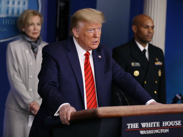 Flanked by members of the Coronavirus Task Force, U.S. President Donald Trump speaks during a news briefing on the latest development of the coronavirus outbreak in the U.S. in the James Brady Press Briefing Room at the White House March 19, 2020 in Washington, DC. With Americans testing positive by …