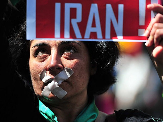 A woman demonstrates against the situation in Iran during the Christopher Street Day (CSD)