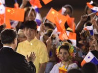 China's President Xi Jinping (L) waves at children upon landing at the airport in Panama City, on December 2, 2018. - Chinese President Xi Jinping visits Panama after attending the G20 Summit in Argentina. (Photo by Luis ACOSTA / AFP) (Photo credit should read LUIS ACOSTA/AFP via Getty Images)