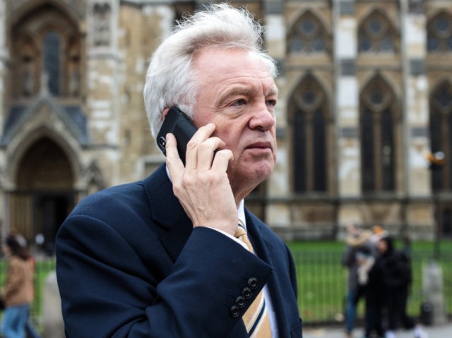 LONDON, ENGLAND - DECEMBER 12: Former Brexit Secretary David Davis speaks on his phone as