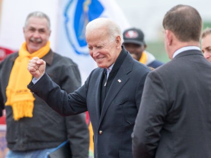 DORCHESTER, MA - APRIL 18: Former Vice President Joe Biden reacts in front of a Stop & Shop following a speech in support of striking union workers on April 18, 2019 in Dorchester, Massachusetts. Thousands of unionized Stop & Shop workers across New England walked off the job last week …