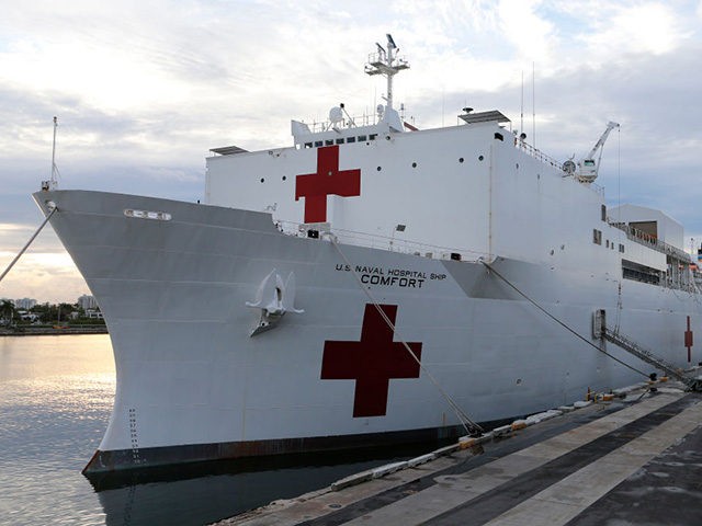 MIAMI, FL - JUNE 18: The U.S. Navy hospital ship USNS Comfort is shown docked at the Port of Miami prior to a tour of the vessel by U.S. Vice President Mike Pence on June 18, 2019 in Miami, Florida. The ship is set to depart on a medical assistance …