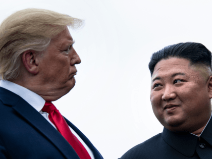 US President Donald Trump and North Korea's leader Kim Jong-un talk before a meeting in th