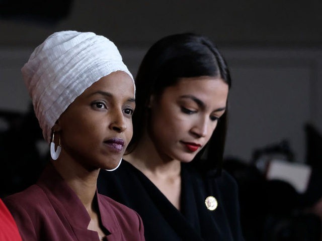 WASHINGTON, DC - JULY 15: (L-R) U.S. Reps. Ayanna Pressley (D-MA), Ilhan Omar (D-MN) and A