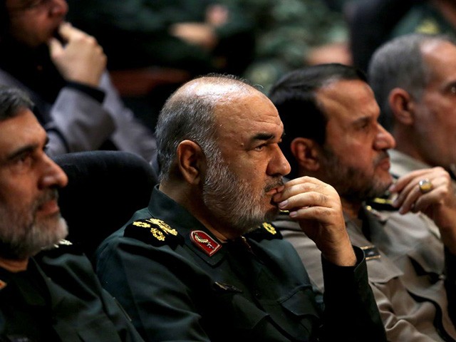Iranian Revolutionary Guards commander Major General Hossein Salami (2-L) and General Amir Ali Hajizadeh (L), the head of the Revolutionary Guard's aerospace division, are pictured at Tehran's Islamic Revolution and Holy Defence museum, during the unveiling of an exhibition of what Iran says are US and other drones captured in its territory, in the capital Tehran on September 21, 2019. - Iran's Revolutionary Guards commander today warned any country that attacks the Islamic republic will see its territory become the "main battlefield" as he opened an exhibition of captured drones. (Photo by ATTA KENARE / AFP) (Photo credit should read ATTA KENARE/AFP via Getty Images)