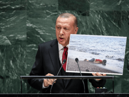 President of Turkey Recep Tayyip Erdogan holds up a photo of Alan Kurdi, a young Syrian refugee who drowned in the Mediterranean Sea while he and his family tried to reach Europe amid the European refugee crisis, while speaking the United Nations General Assembly at UN headquarters on September 24, …