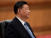 China's President Xi Jinping listens to Japans Prime Minister Shinzo Abe during a meeting at the Great Hall of the People in Beijing on December 23, 2019. (Photo by Noel CELIS / POOL / AFP) (Photo by NOEL CELIS/POOL/AFP via Getty Images)