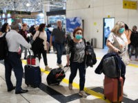 ADDIS ABABA, ETHIOPIA - JANUARY 31: A passenger wears a mask following an outbreak of the Coronavirus in China at Addis Ababa Bole International Airport on January 31, 2020 in Addis Ababa, Ethiopia. The number of those who have died from the Wuhan coronavirus, known as 2019-nCoV, in China climbed …