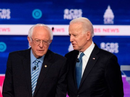 Democratic presidential hopefuls Vermont Senator Bernie Sanders (L) and Former Vice President Joe Biden (C) talk while Minnesota Senator Amy Klobuchar looks on ahead of the tenth Democratic primary debate of the 2020 presidential campaign season co-hosted by CBS News and the Congressional Black Caucus Institute at the Gaillard Center …