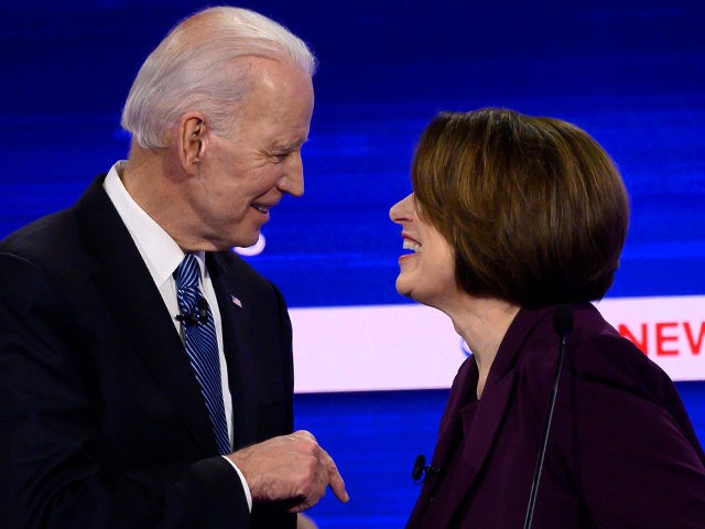 Democratic presidential hopefuls former Vice President Joe Biden (L) and Minnesota Senator Amy Klobuchar speak after the tenth Democratic primary debate of the 2020 presidential campaign season co-hosted by CBS News and the Congressional Black Caucus Institute at the Gaillard Center in Charleston, South Carolina, on February 25, 2020. (Photo …