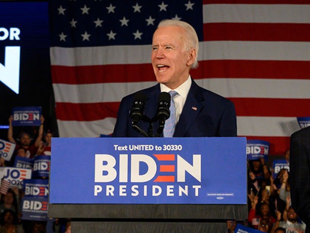 Democratic presidential candidate Joe Biden, accompanied by his wife Jill Biden delivers r