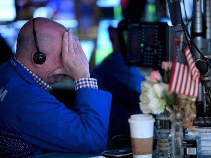 Traders work during the opening bell at the New York Stock Exchange (NYSE) on March 5, 202