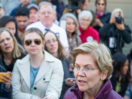 Democratic presidential candidate Massachusetts Senator Elizabeth Warren announces the sus