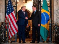 US President Donald Trump (L) shakes hands with Brazilian President Jair Bolsonaro during a diner at Mar-a-Lago in Palm Beach, Florida, on March 7, 2020. (Photo by JIM WATSON / AFP) (Photo by JIM WATSON/AFP via Getty Images)