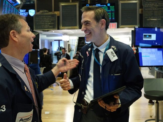 NEW YORK, NEW YORK - FEBRUARY 12: Traders work on the floor of the New York Stock Exchange