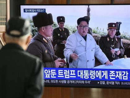 A man watches a television news broadcast showing file footage of North Korea's leader Kim Jong Un, at a railway station in Seoul on March 9, 2020. - Nuclear-armed North Korea on March 9 fired what Japan said appeared to be ballistic missiles, a week after a similar weapons test …