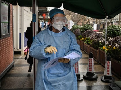 A medical worker wearing protective clothing as a preventive measure against the COVID-19