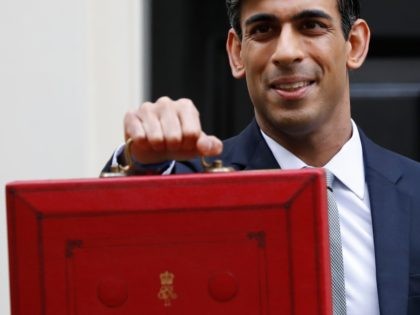 Britain's Chancellor of the Exchequer Rishi Sunak poses for pictures with the Budget