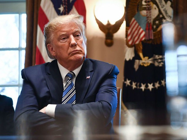 TOPSHOT - US President Donald Trump speaks during a meeting with banking leaders to discus