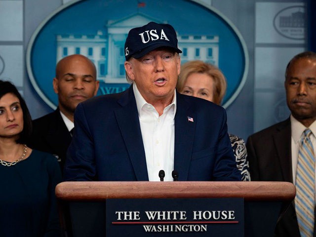 US President Donald Trump gives a press briefing about the Coronavirus (COVID-19) alongside members of the Coronavirus Task Force in the Brady Press Briefing Room at the White House in Washington, DC, March 14, 2020. - President Donald Trump says he has taken coronavirus test and waiting for the result. …