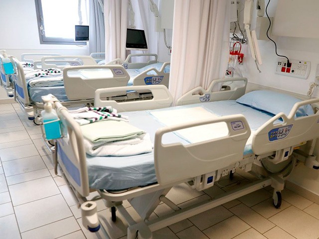 This picture taken on March 16, 2020 during a press presentation of the hospitalisation service for future patients with coronavirus at Samson Assuta Ashdod University Hospital in the southern Israeli city of Ashdod, shows empty hospital beds in a ward. - As of March 16, Israel has 255 confirmed cases of coronavirus with no fatalities but tens of thousands in home-quarantine. Authorities have banned gatherings of more than 10 people and ordered schools, universities, restaurants and cafes to close, among other measures. (Photo by JACK GUEZ / AFP) (Photo by JACK GUEZ/AFP via Getty Images)