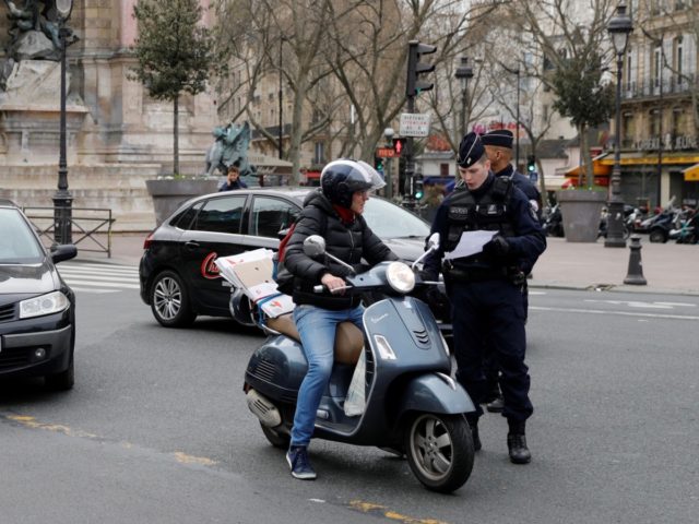 French police officers patrol and control citizens in Paris on March 17, 2020 while a strick lockdown comes into in effect to stop the spread of the COVID-19 in the country. - French President asked people to stay at home to avoid the spreading the Covid-19, saying only necessary trips …
