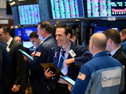 Traders work during the closing bell at the New York Stock Exchange (NYSE) on March 17, 2020 at Wall Street in New York City. - Wall Street stocks rallied Tuesday on expectations for massive federal stimulus to address the economic hit from the coronavirus, partially recovering some of their losses …