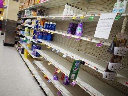 Near empty shelves for detergent are seen in a supermarket in Washington, DC on March 20, 2020. - The coronavirus outbreak has transformed the US virtually overnight from a place of boundless consumerism to one suddenly constrained by nesting and social distancing. (Photo by MANDEL NGAN / AFP)