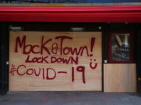 A sign in spray paint informs customers that the Mokatown launch party is cancelled due to the coronavirus outbreak in Cardiff on March 24, 2020 after Britain ordered a lockdown to slow the spread of the novel coronavirus. - Britain was under lockdown March 24, its population joining around 1.7 …