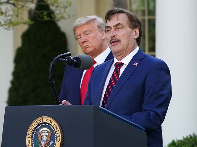 US President Donald Trump listens as Michael J. Lindell, CEO of MyPillow Inc., speaks during the daily briefing on the novel coronavirus, COVID-19, in the Rose Garden of the White House in Washington, DC, on March 30, 2020. (Photo by MANDEL NGAN / AFP) (Photo by MANDEL NGAN/AFP via Getty …