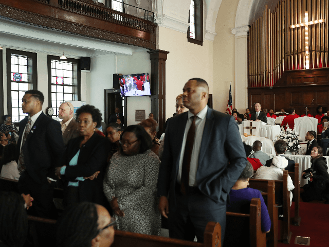 People stand with their backs to Democratic presidential candidate, former New York City mayor Mike Bloomberg as he speaks during a worship event at the Brown Chapel AME Church on March 1, 2020 in Selma, Alabama. The people turned their backs because of among other issues they disagree with Mr. …