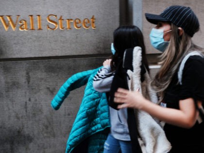 NEW YORK, NEW YORK - MARCH 09: People walk by the New York Stock Exchange (NYSE) on March