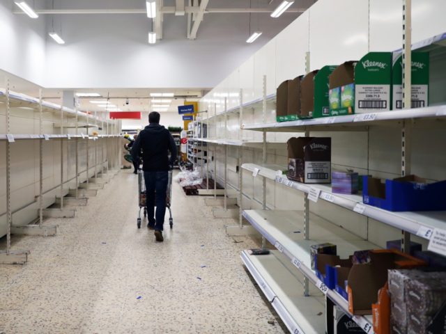 SOUTHAMPTON - MARCH 18: Empty shelves are seen inside a Tesco supermarket on March 18, 2020 in Southampton, United Kingdom. After spates of "panic buying" cleared supermarket shelves of items like toilet paper and cleaning products, stores across the UK have introduced limits on purchases during the COVID-19 pandemic. Some …
