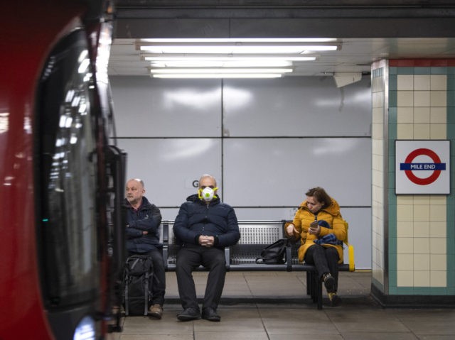 VARIOUS CITIES, - MARCH 23: Commuters wearing face protection masks travel on the Central